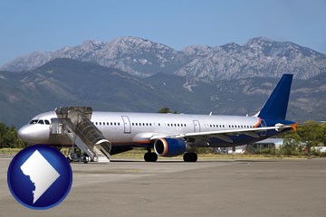 commercial aircraft at an airport, with mountainous background - with Washington, DC icon