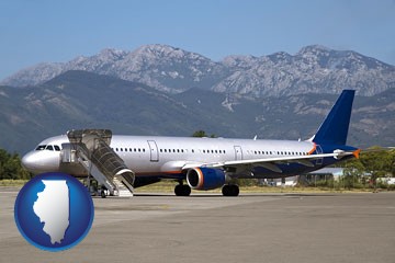 commercial aircraft at an airport, with mountainous background - with Illinois icon