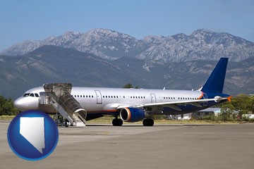 commercial aircraft at an airport, with mountainous background - with Nevada icon