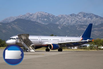 commercial aircraft at an airport, with mountainous background - with Pennsylvania icon