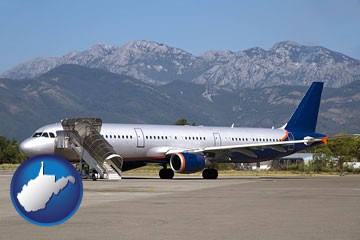 commercial aircraft at an airport, with mountainous background - with West Virginia icon