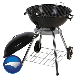 a kettle-style charcoal grill - with North Carolina icon