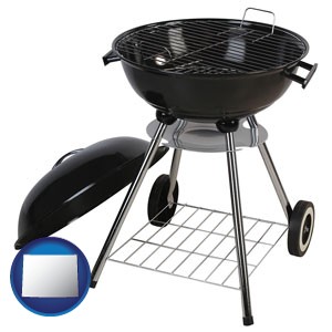 a kettle-style charcoal grill - with Wyoming icon