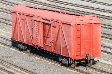 a box car in a railroad freight yard