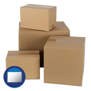 a stack of cardboard boxes - with Colorado icon