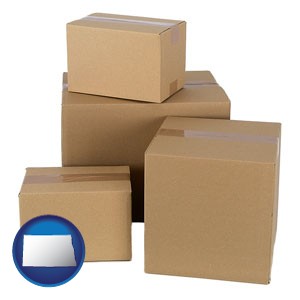 a stack of cardboard boxes - with North Dakota icon