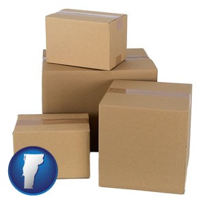 a stack of cardboard boxes - with Vermont icon