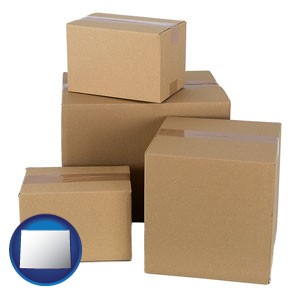 a stack of cardboard boxes - with Wyoming icon