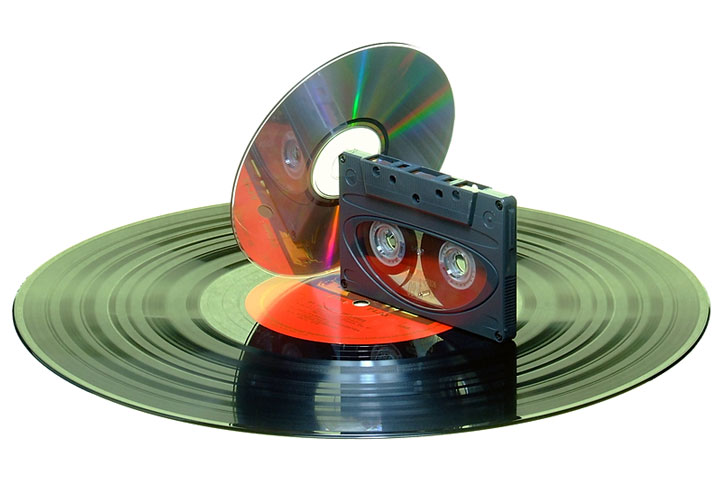 an audio compact disc, a compact cassette, and a vinyl record (large image)