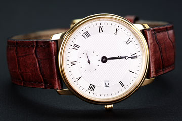 a classic wristwatch with leather watchband