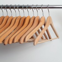 a closet rod and wood clothes hangers