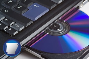 loading software into a laptop computer from a cd - with Arkansas icon