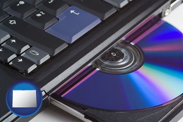 loading software into a laptop computer from a cd - with Colorado icon