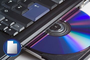 loading software into a laptop computer from a cd - with Utah icon