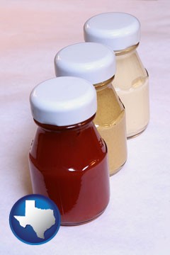 ketchup, mustard, and mayonnaise condiments - with Texas icon