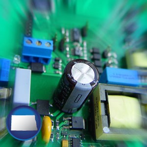 electronic components on a circuit board - with North Dakota icon