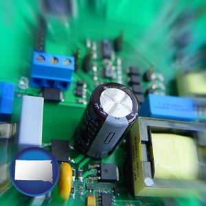 electronic components on a circuit board - with South Dakota icon