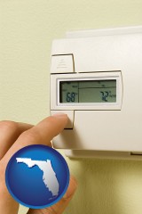 florida map icon and a heating system thermostat