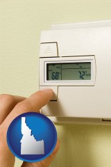 idaho map icon and a heating system thermostat