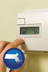 massachusetts map icon and a heating system thermostat