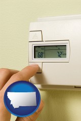montana map icon and a heating system thermostat