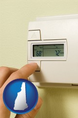 new-hampshire map icon and a heating system thermostat