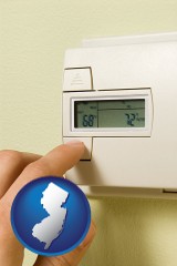 new-jersey map icon and a heating system thermostat