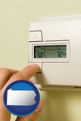 pennsylvania map icon and a heating system thermostat