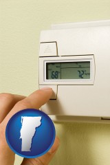 vermont map icon and a heating system thermostat