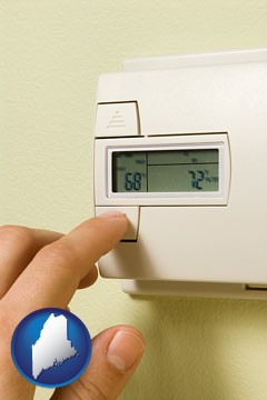 a heating system thermostat - with Maine icon