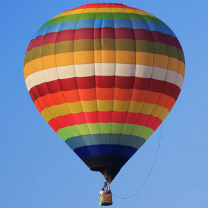 a hot air balloon against a blue sky background