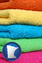minnesota map icon and colorful bath towels