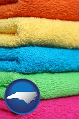 north-carolina map icon and colorful bath towels