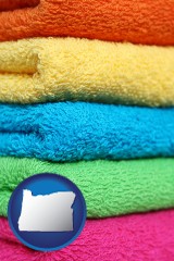 oregon map icon and colorful bath towels