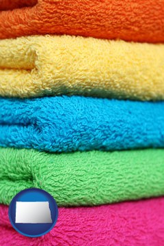 colorful bath towels - with North Dakota icon