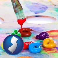 new-jersey map icon and colorful oil paints and paintbrush