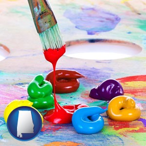 colorful oil paints and paintbrush - with Alabama icon