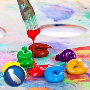 colorful oil paints and paintbrush - with California icon