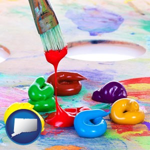 colorful oil paints and paintbrush - with Connecticut icon