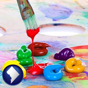colorful oil paints and paintbrush - with Washington, DC icon
