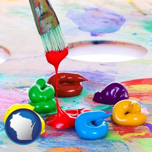 colorful oil paints and paintbrush - with Wisconsin icon