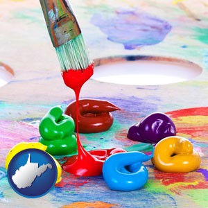 colorful oil paints and paintbrush - with West Virginia icon