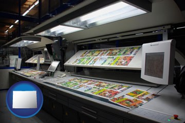 a commercial offset printing press - with Colorado icon