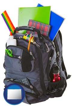 a backpack filled with school supplies - with Colorado icon