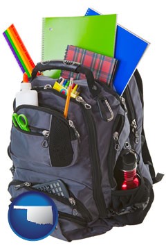 a backpack filled with school supplies - with Oklahoma icon