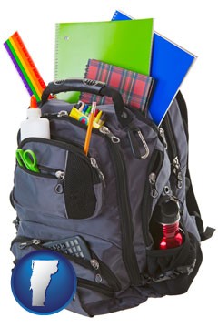 a backpack filled with school supplies - with Vermont icon