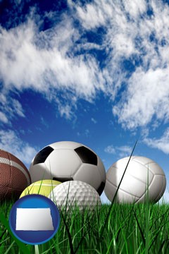 a football, a golf ball, a soccer ball, a tennis ball, and a volleyball - with North Dakota icon