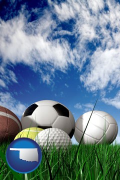 a football, a golf ball, a soccer ball, a tennis ball, and a volleyball - with Oklahoma icon