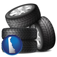 de map icon and four tires with alloy wheels
