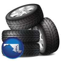 md map icon and four tires with alloy wheels